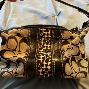 Black and gray Coach purse